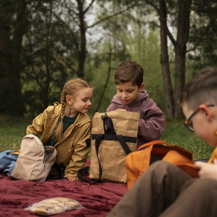 view-little-kids-with-backpacks-spending-time-nature-outdoors-760x760.webp